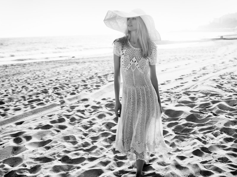 Claudia Schiffer soaked up the sun in Harper's Bazaar UK July. / Photo by Horst Diekgerdes